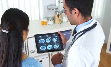 Mexican doctor explaining brain scans to patient